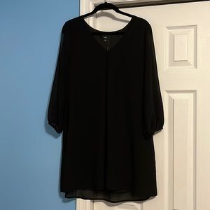 Women’s black dress size L. Never worn